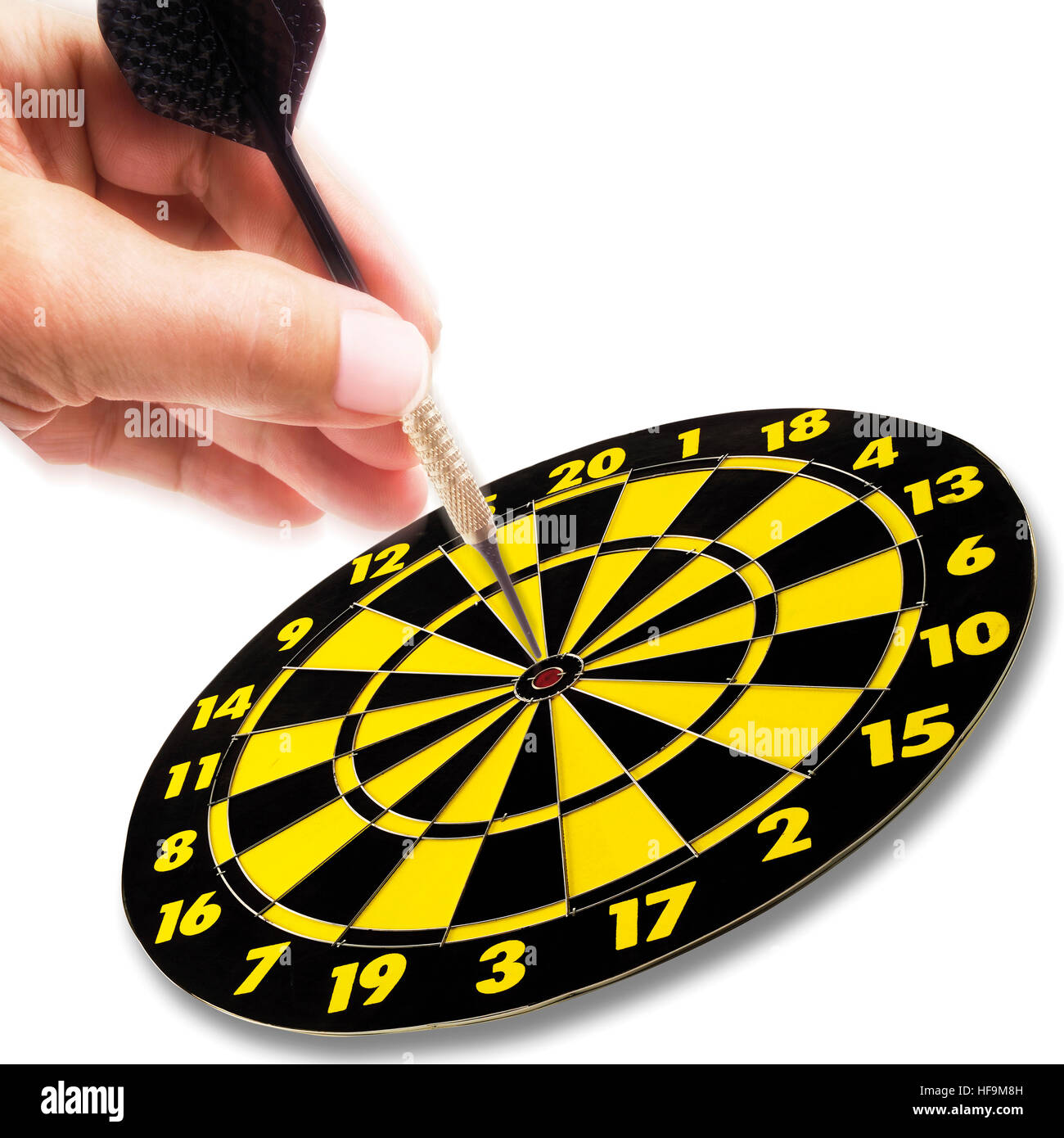 Hand holding dart in action, aiming for the bullseye Stock Photo Alamy
