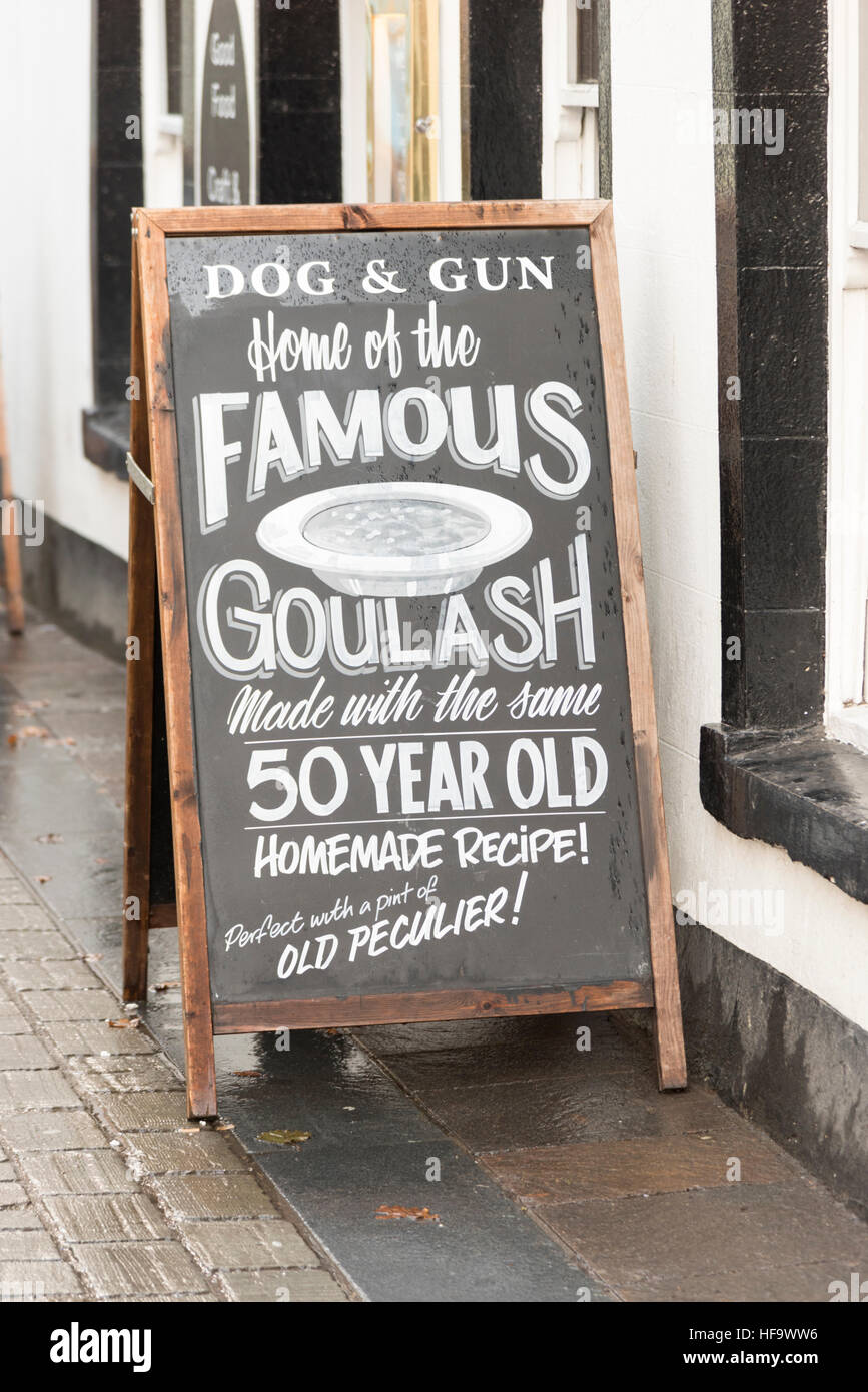 A sign outside the Dog and Gun pub in Keswick advertising theor famous Hungarian Goulash food Stock Photo