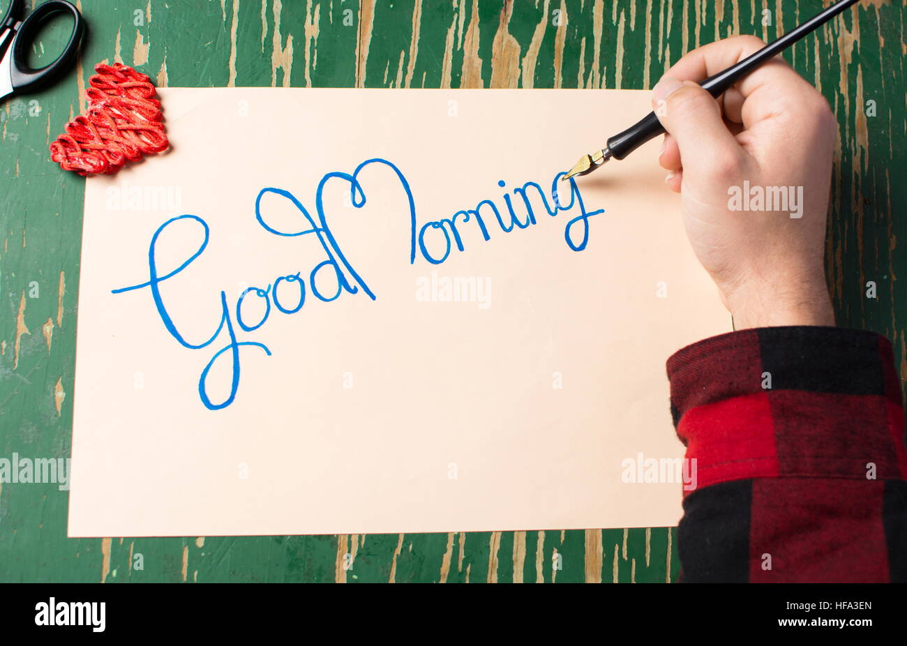 Man writing a good morning note top view Stock Photo