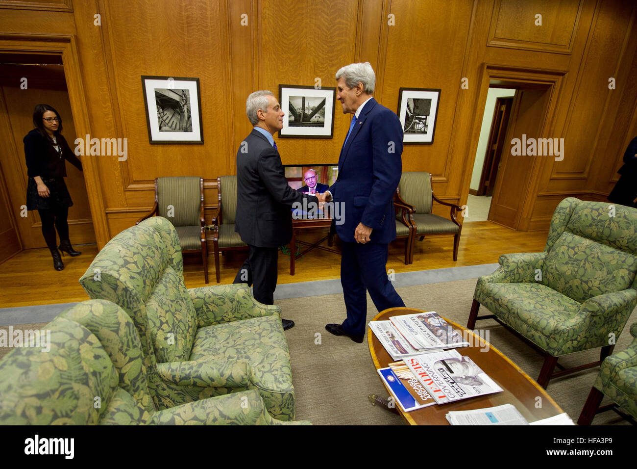 Chicago Mayor Rahm Emanuel greets . Secretary of State John Kerry after  the Secretary arrived in his outer office at City Hall for a courtesy call  during a day stop in Chicago,