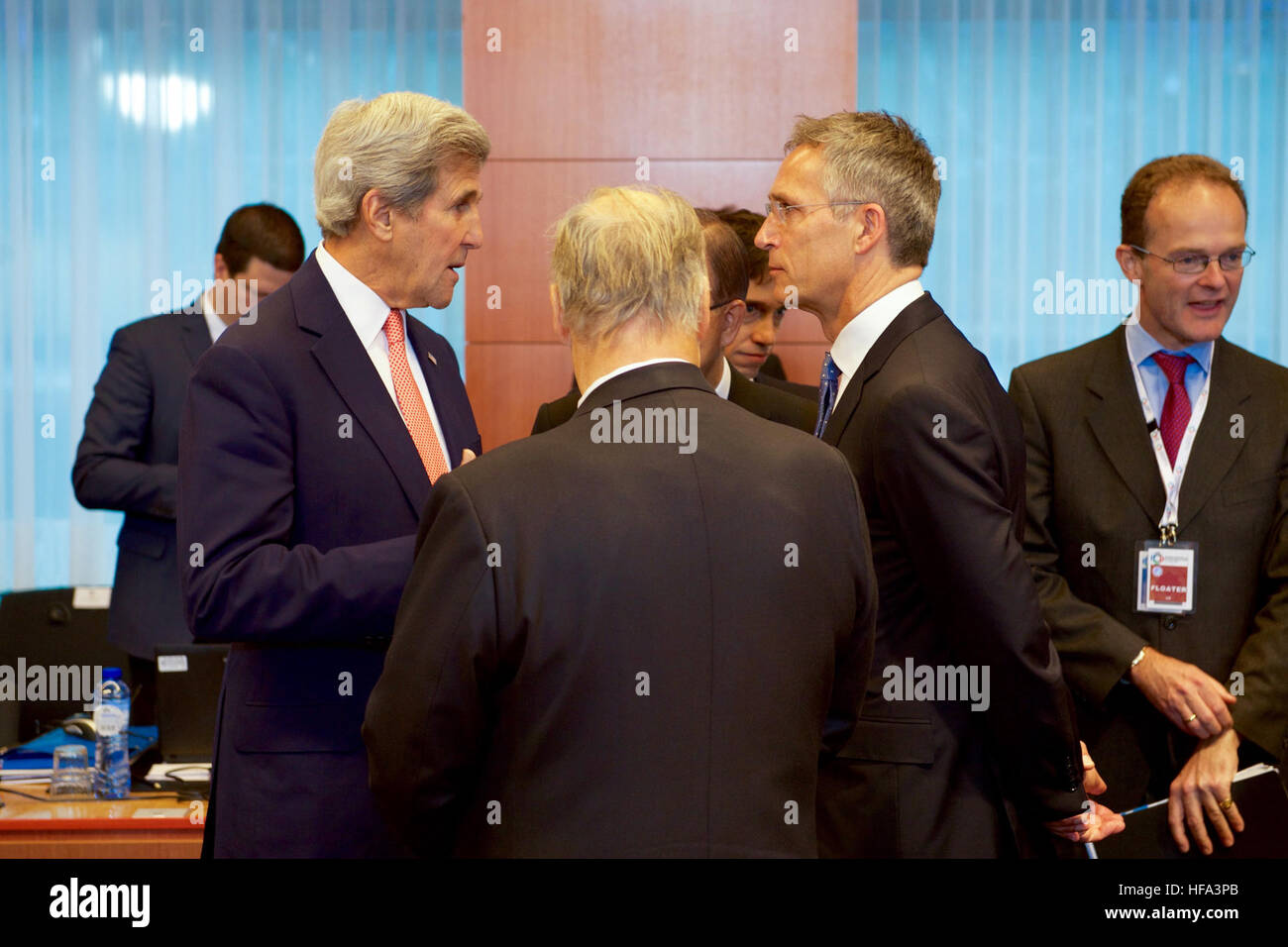 U.S. Secretary of State John Kerry chats with NATO Secretary General Jens Stoltenberg on October 5, 2016, at the European Commission's Justus Lipsius Building in Brussels, Belgium, before the start of an international Afghan pledging conference. Stock Photo