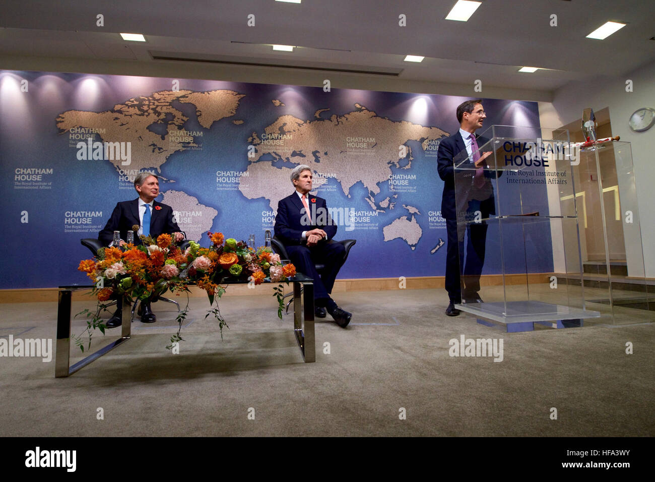 Chatham House Director Robin Niblett addresses U.S. Secretary of State John Kerry and his former counterpart, British Chancellor of the Exchequer Philip Hammond, before the Secretary and Iranian Foreign Minister Javad Zarif received the Chatham House Prize from the famed international think-tank in London, U.K., on October 31, 2016. Stock Photo