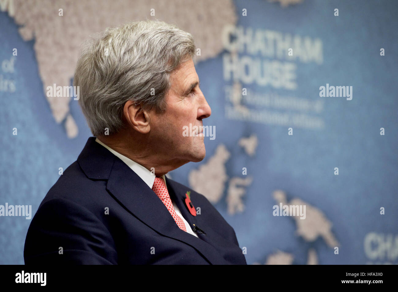 U.S. Secretary of State John Kerry listens as Chatham House Director Robin Niblett addresses him and his former counterpart, British Chancellor of the Exchequer Philip Hammond, before the Secretary and Iranian Foreign Minister Javad Zarif received the Chatham House Prize from the famed international think-tank in London, U.K., on October 31, 2016. Stock Photo