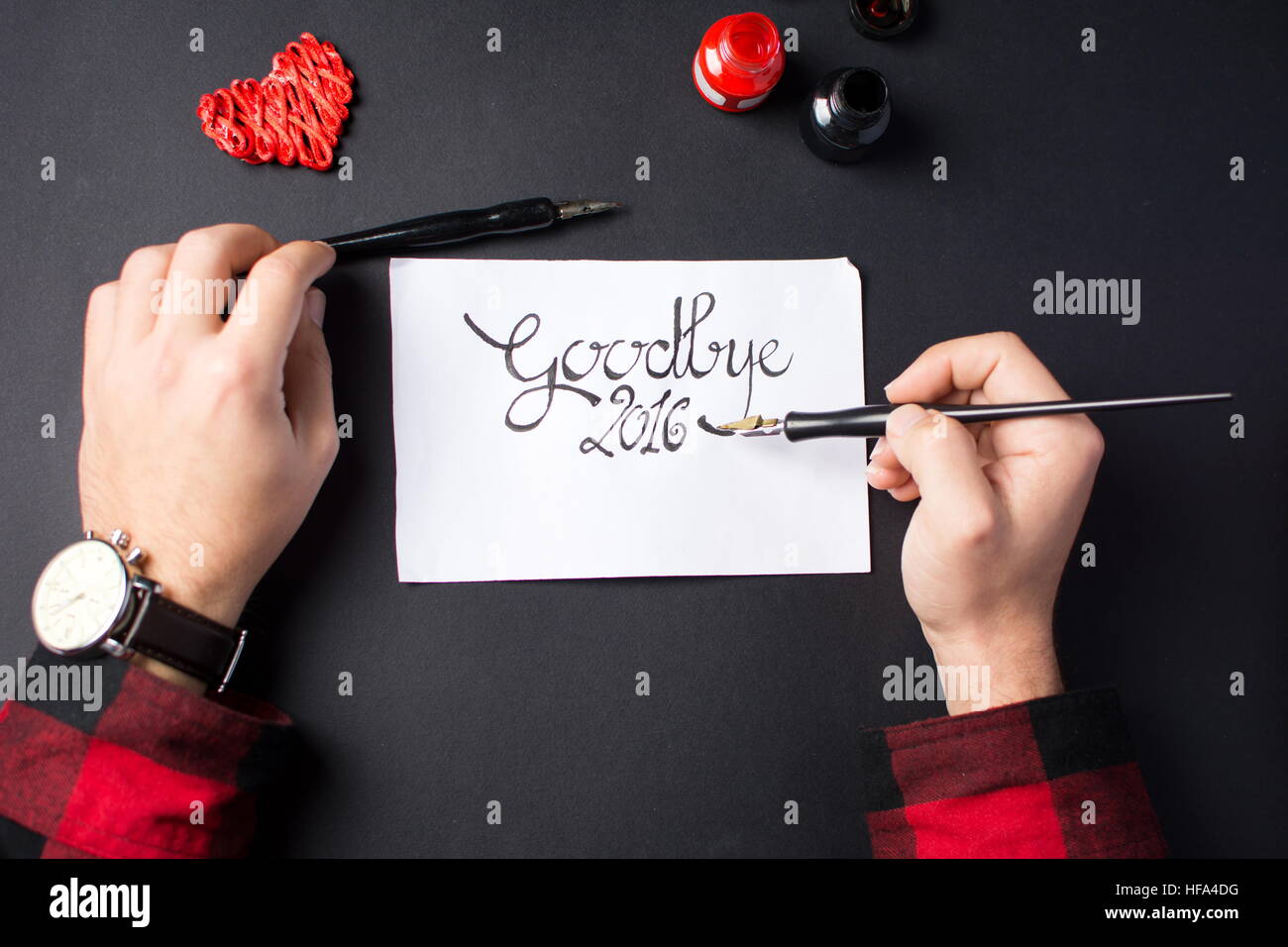 calligraphy writting a goodbye 2016 card in ink Stock Photo