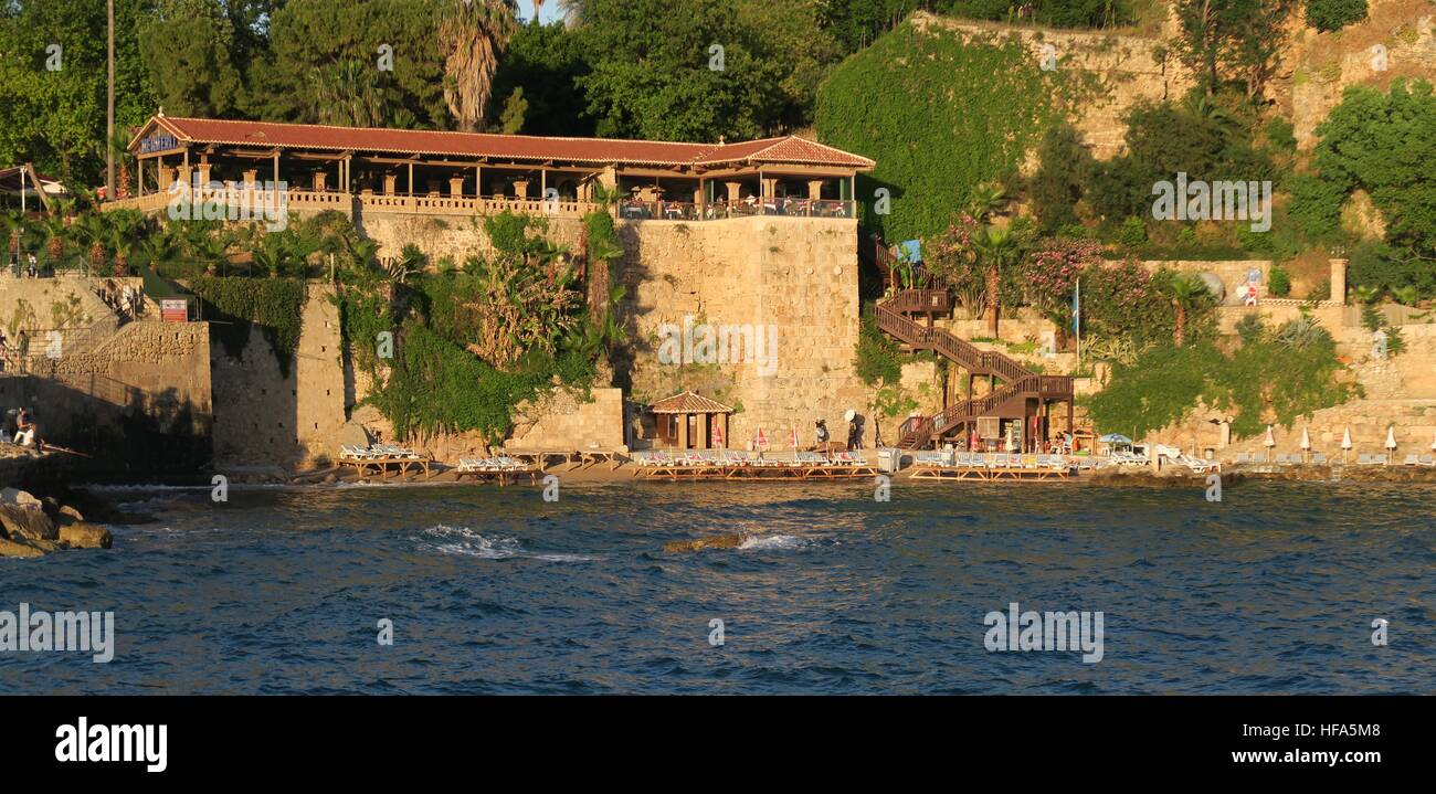 Mermerli Beach and Restaurant with the City Walls in Antalyas Oldtown Kaleici, Turkey Stock Photo