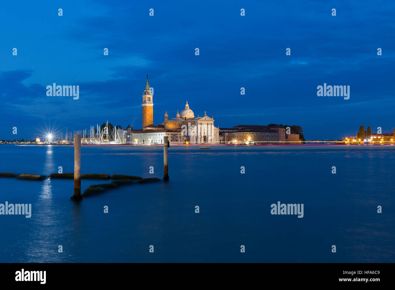 Church of San Giorgio Maggiore with boats traces at night in Venice, Italy. Stock Photo