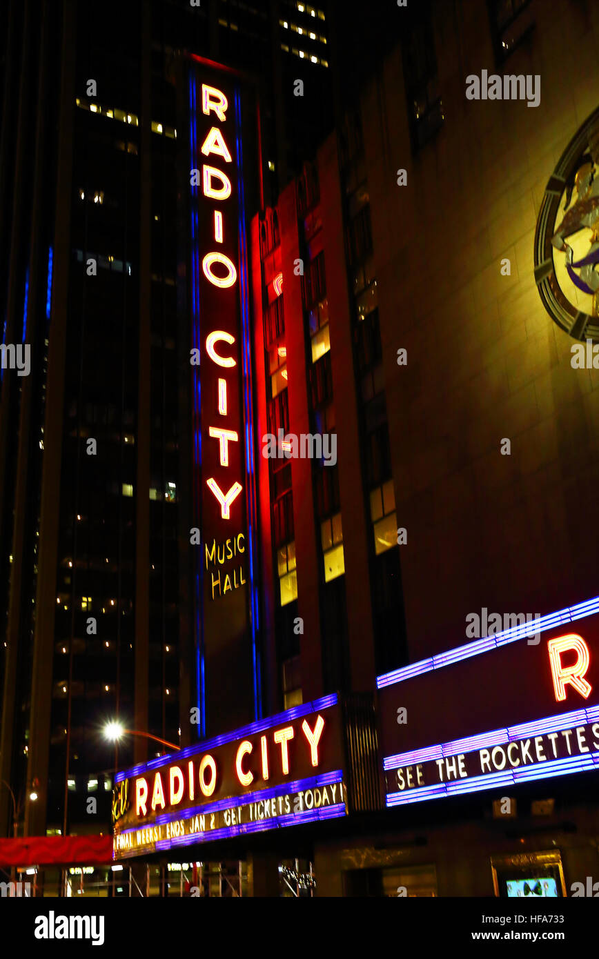 The view looking west on 50th st. in Manhattan shows the entrance and marquee of  Radio City Music Hall. Stock Photo