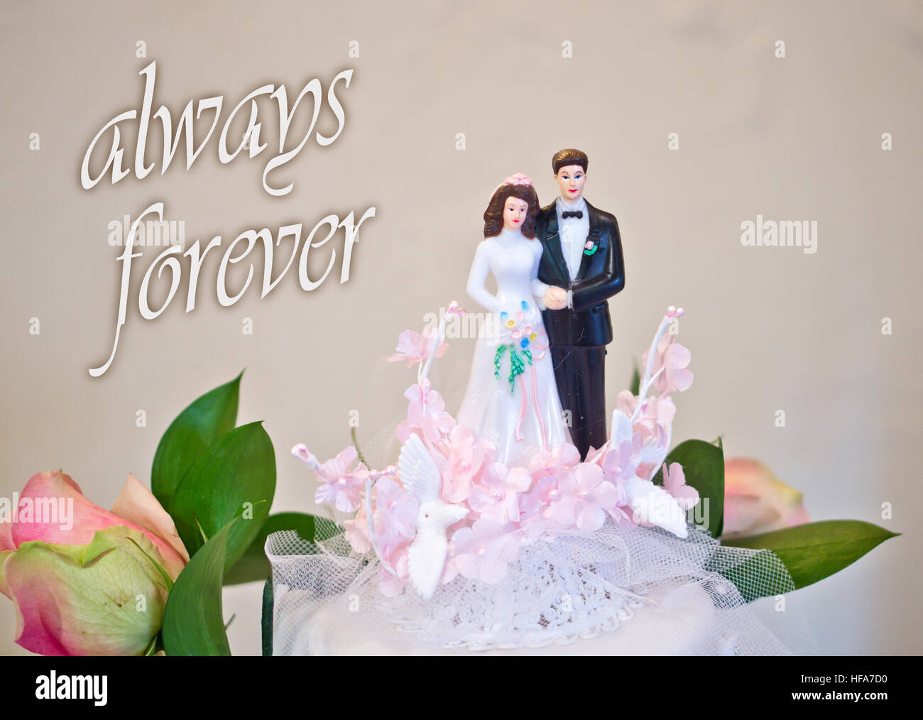 figurines of the bride and groom wedding cake wish all happiness to the newlyweds: always forever Stock Photo