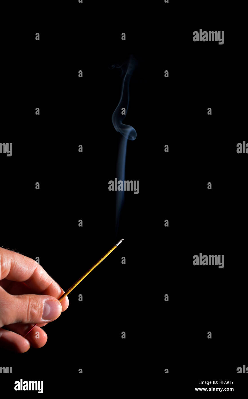 hand with smoking incense stick Stock Photo Alamy