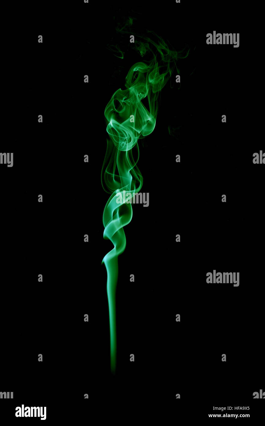 green smoke cloud isolated on black background Stock Photo - Alamy