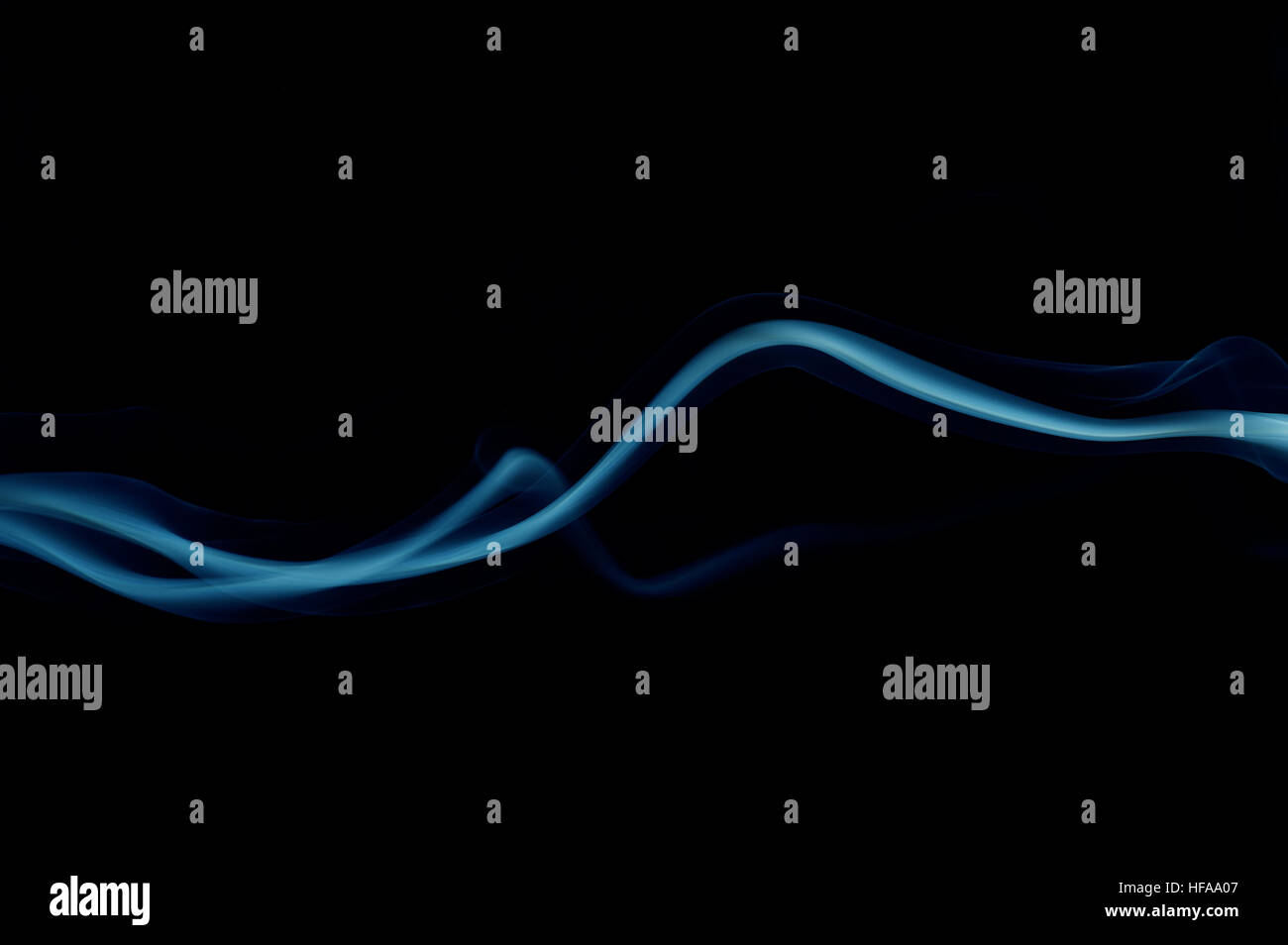 Blue smoke wave isolated on black Stock Photo - Alamy