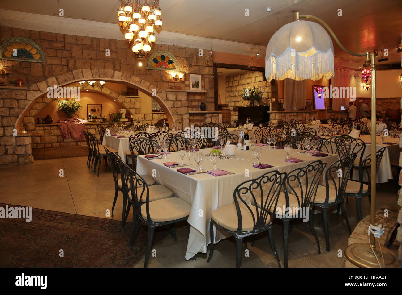 Atmospheric lit restaurant interior Stock Photo