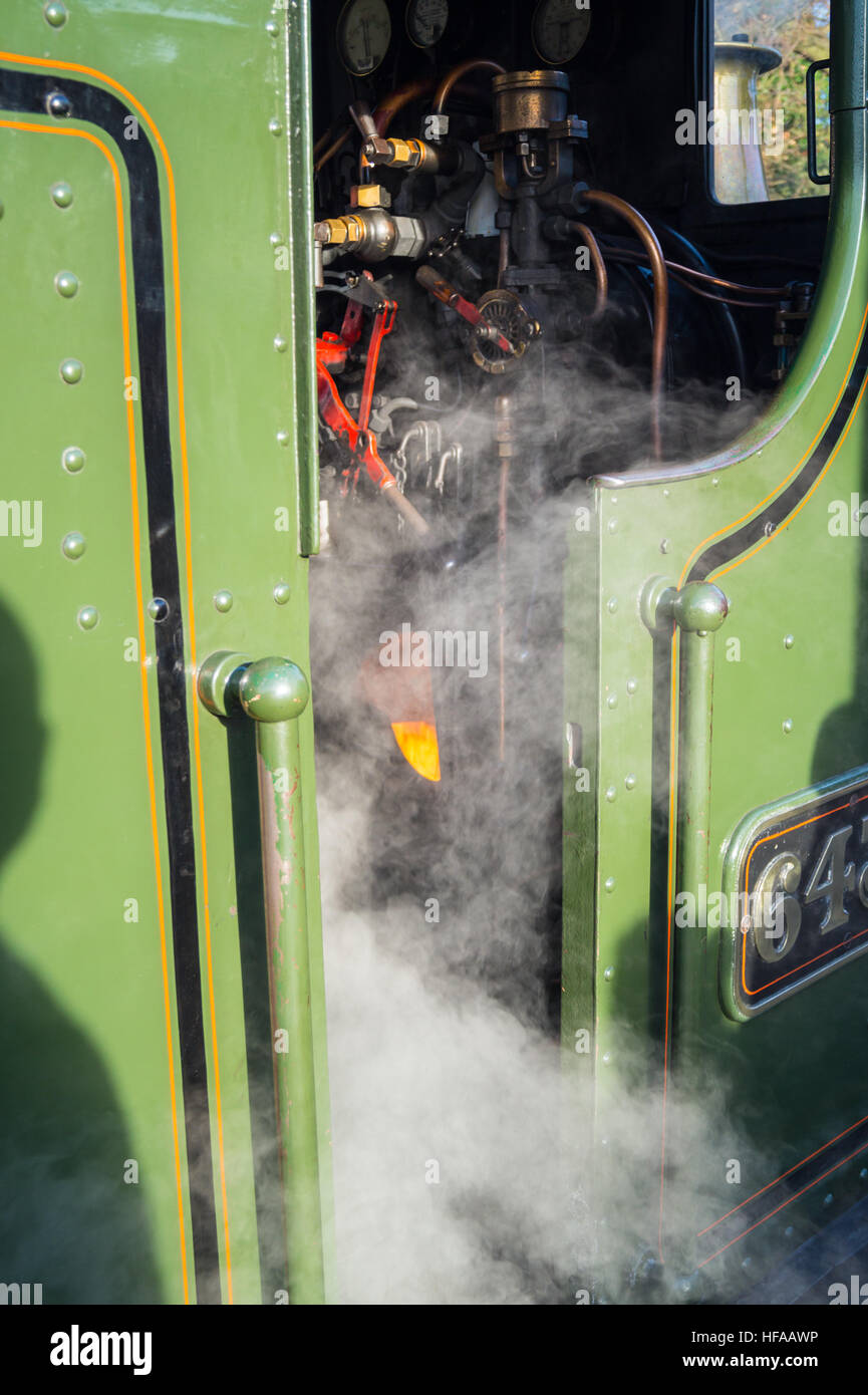 Glowing firebox on footplate of GWR 6430 pannier tank locomotive, 1932, North Weald station, Epping Ongar Railway Essex, England Stock Photo