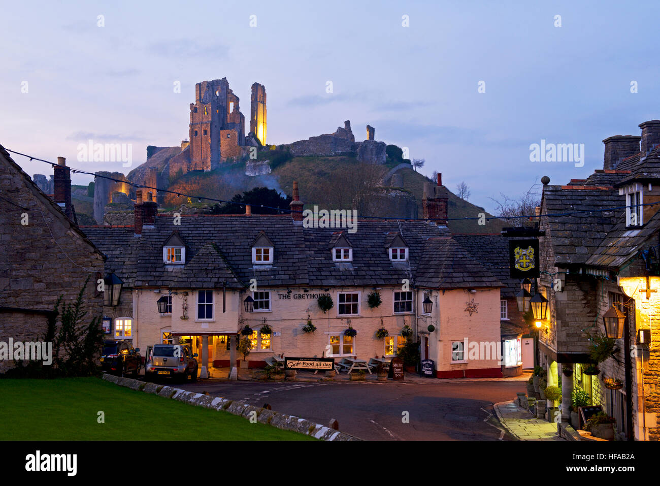 Corfe Castle, flood-lit, Isle of Purbeck, Dorset, England UK Stock Photo