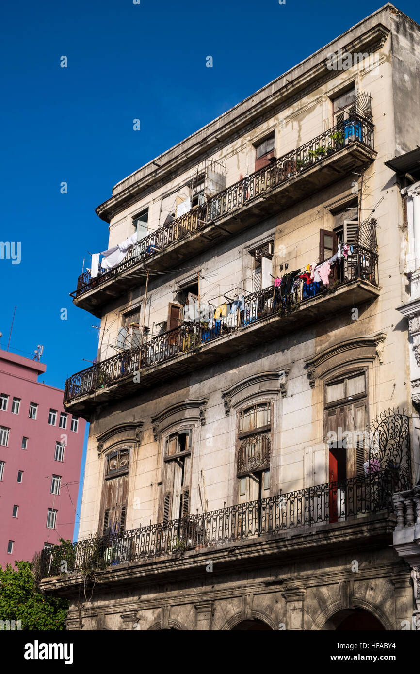 Old building in San Lazaro, with balconies and washing hanging to dry, La Havana, Cuba. Stock Photo