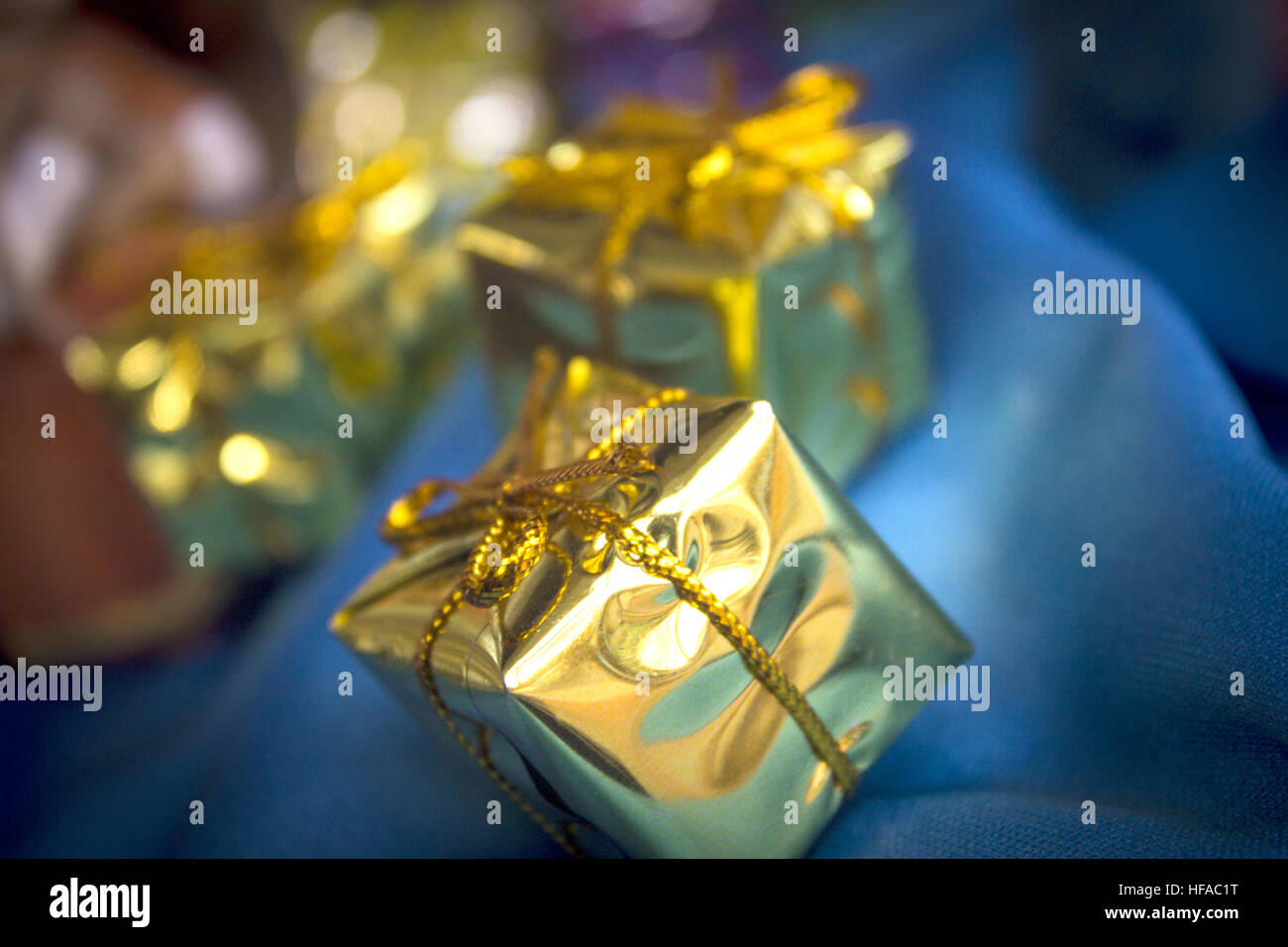 Boxes wrapped with shiny gift wrap. No people Stock Photo - Alamy