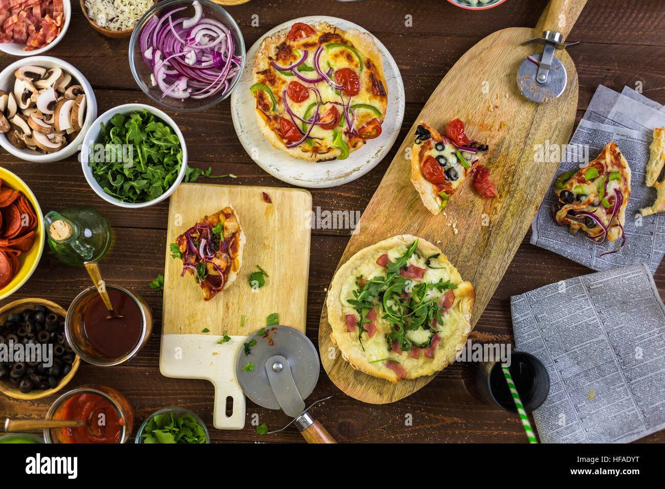 Eating individual pizzas from pizza bar Stock Photo Alamy