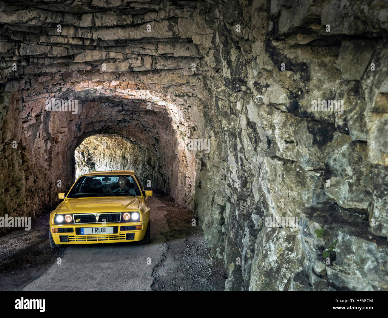 1995 Lancia Delta HF Integrale driving on roads in the French alps Stock Photo