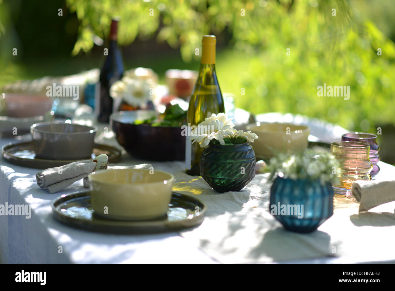 Alfresco dining, table set for an evening meal outside Stock Photo