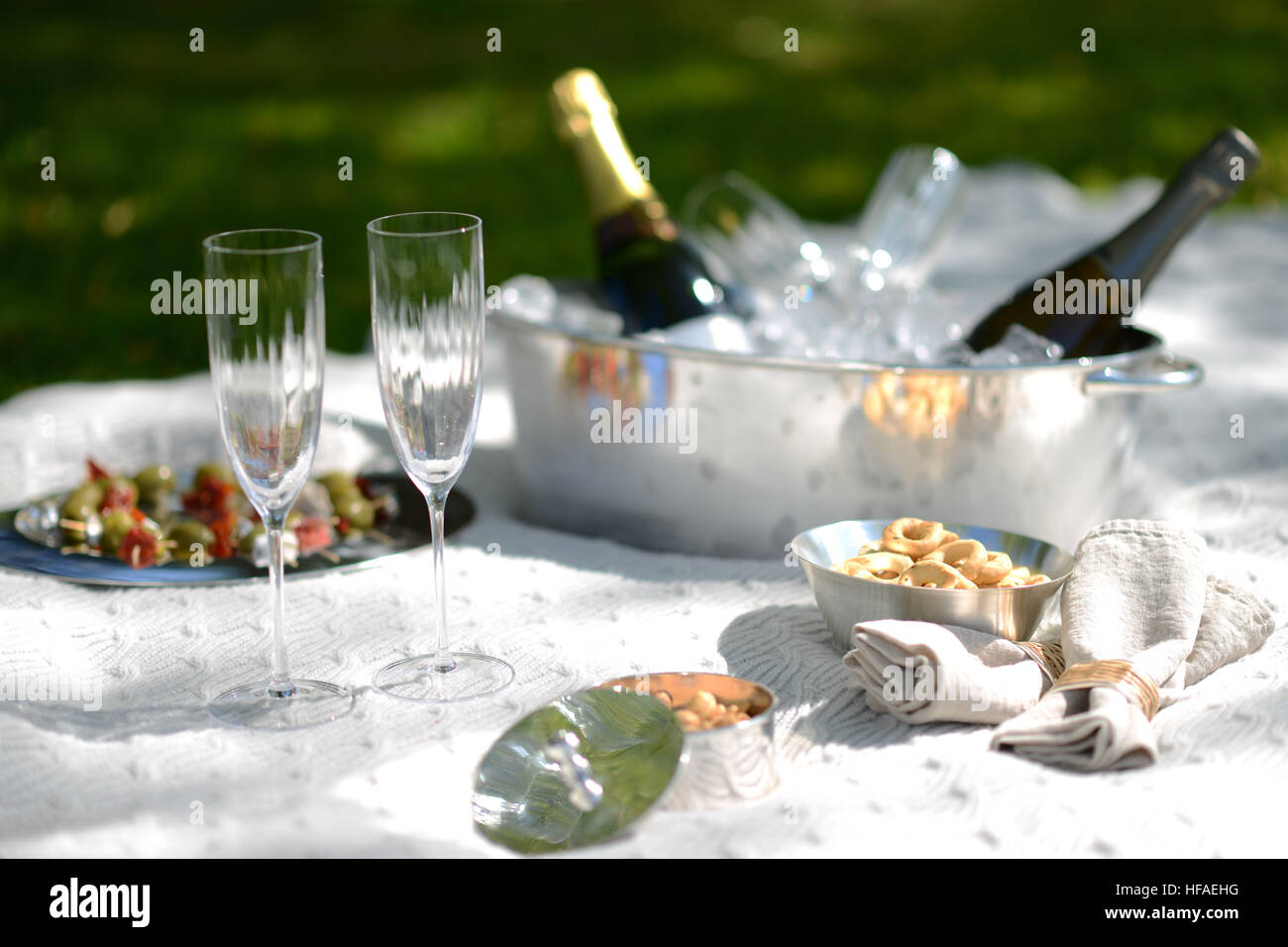 luxury summer picnic with champagne and silverware Stock Photo