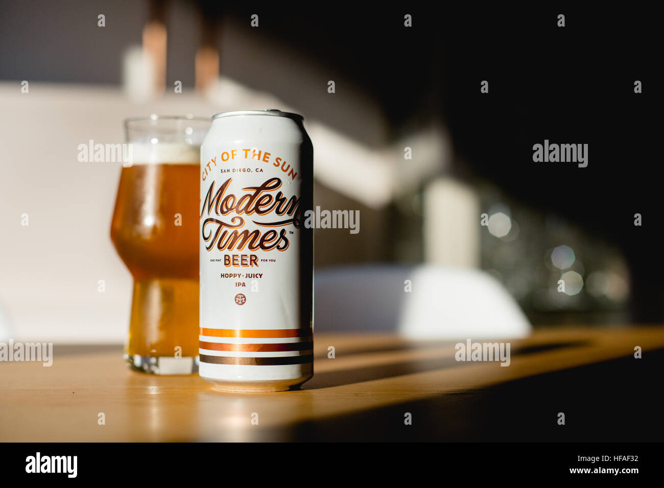 Can of Modern Times Brewery with filled glass city of the sun beer
