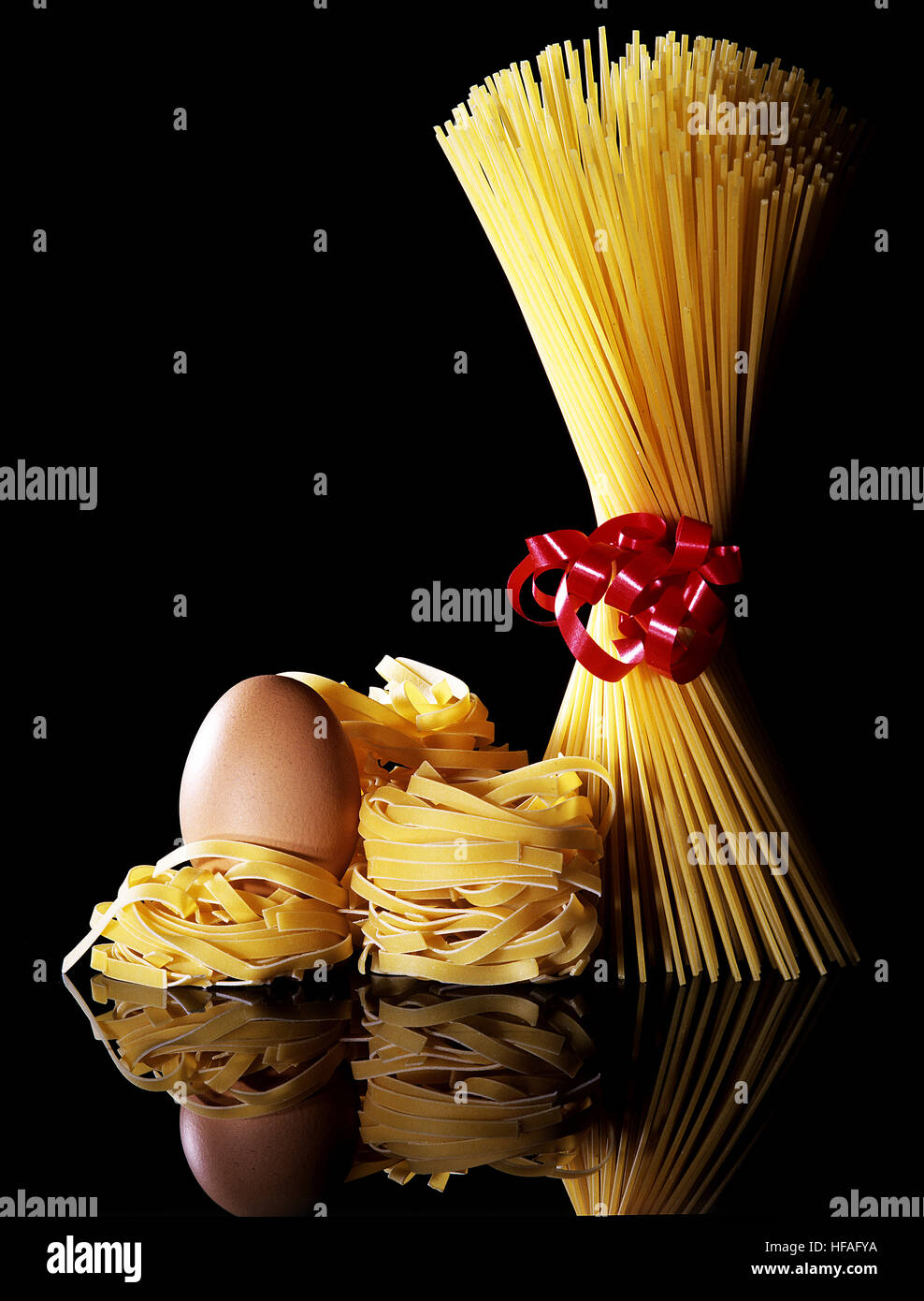 Spaghetti Pasta and Egg against Black Background Stock Photo Alamy