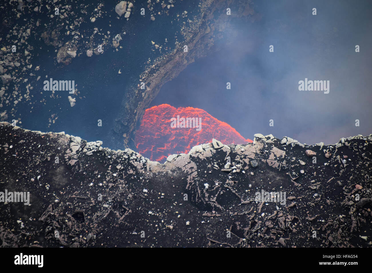 Lava and smoke from gases visible at Santiago crater, Masaya Caldera, Nicaragua Stock Photo