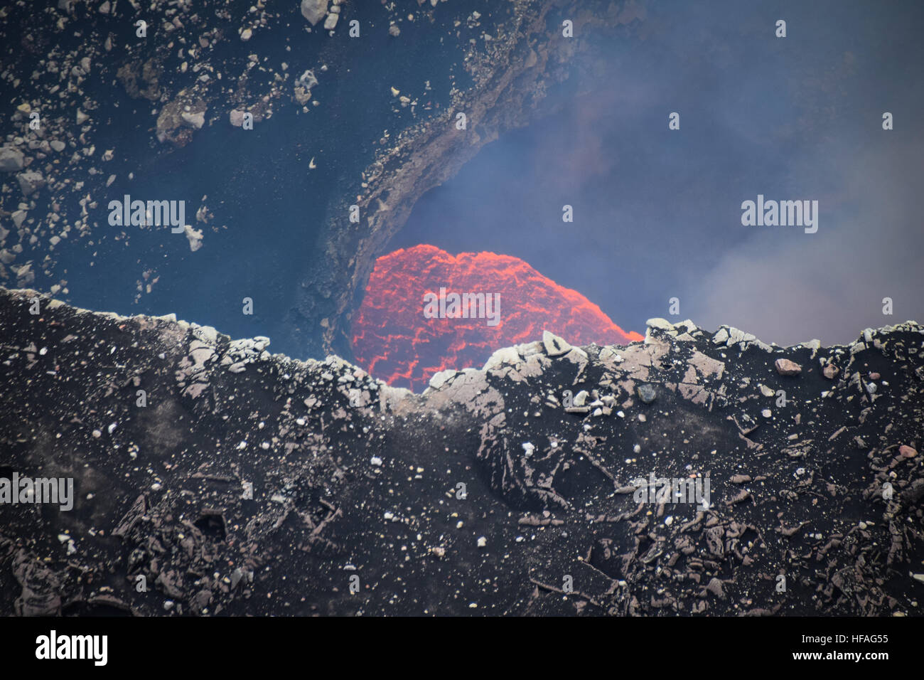 Lava and smoke from gases visible at Santiago crater, Masaya Caldera, Nicaragua Stock Photo