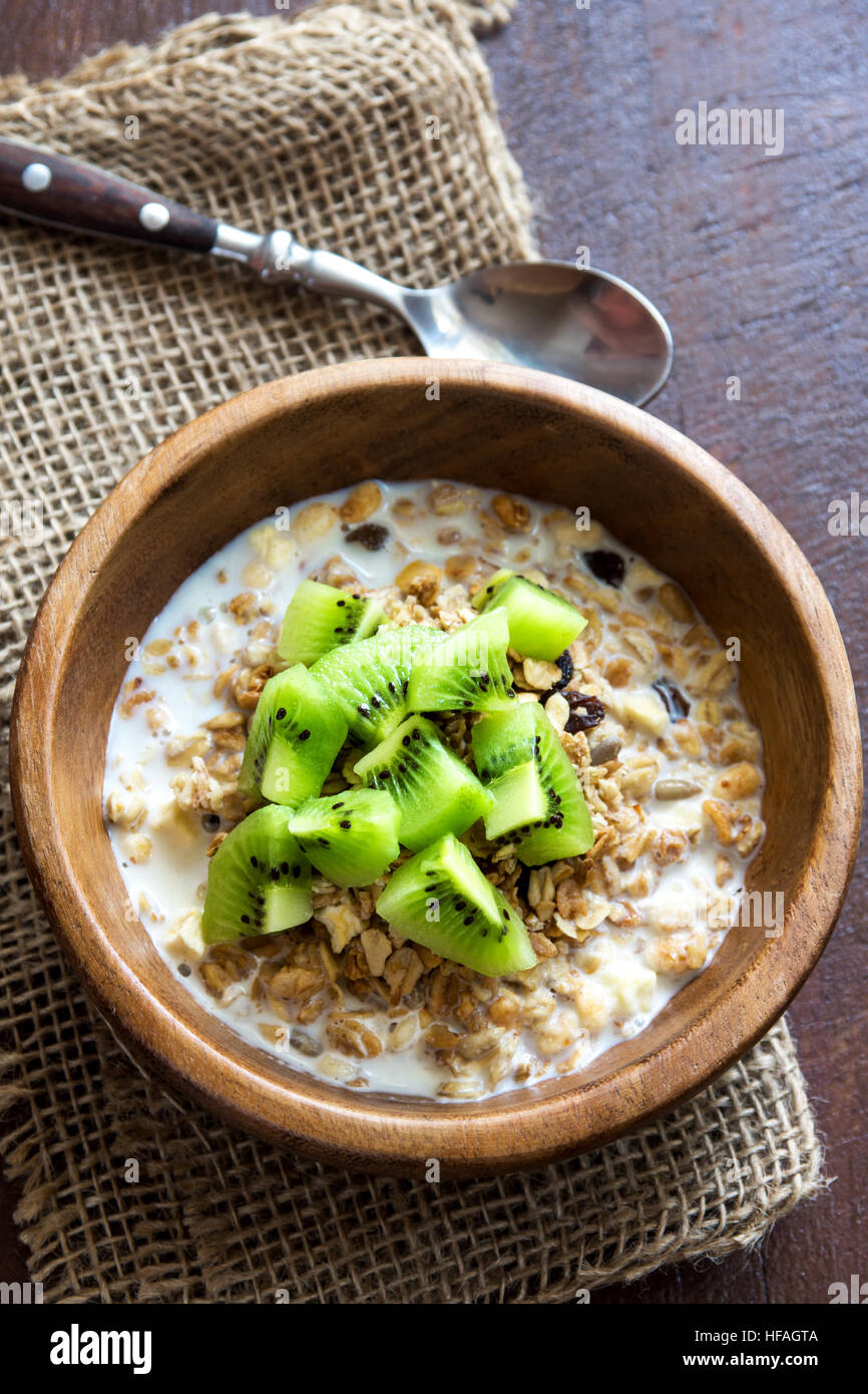 Homemade granola with milk and kiwi fruit for healthy breakfast Stock Photo