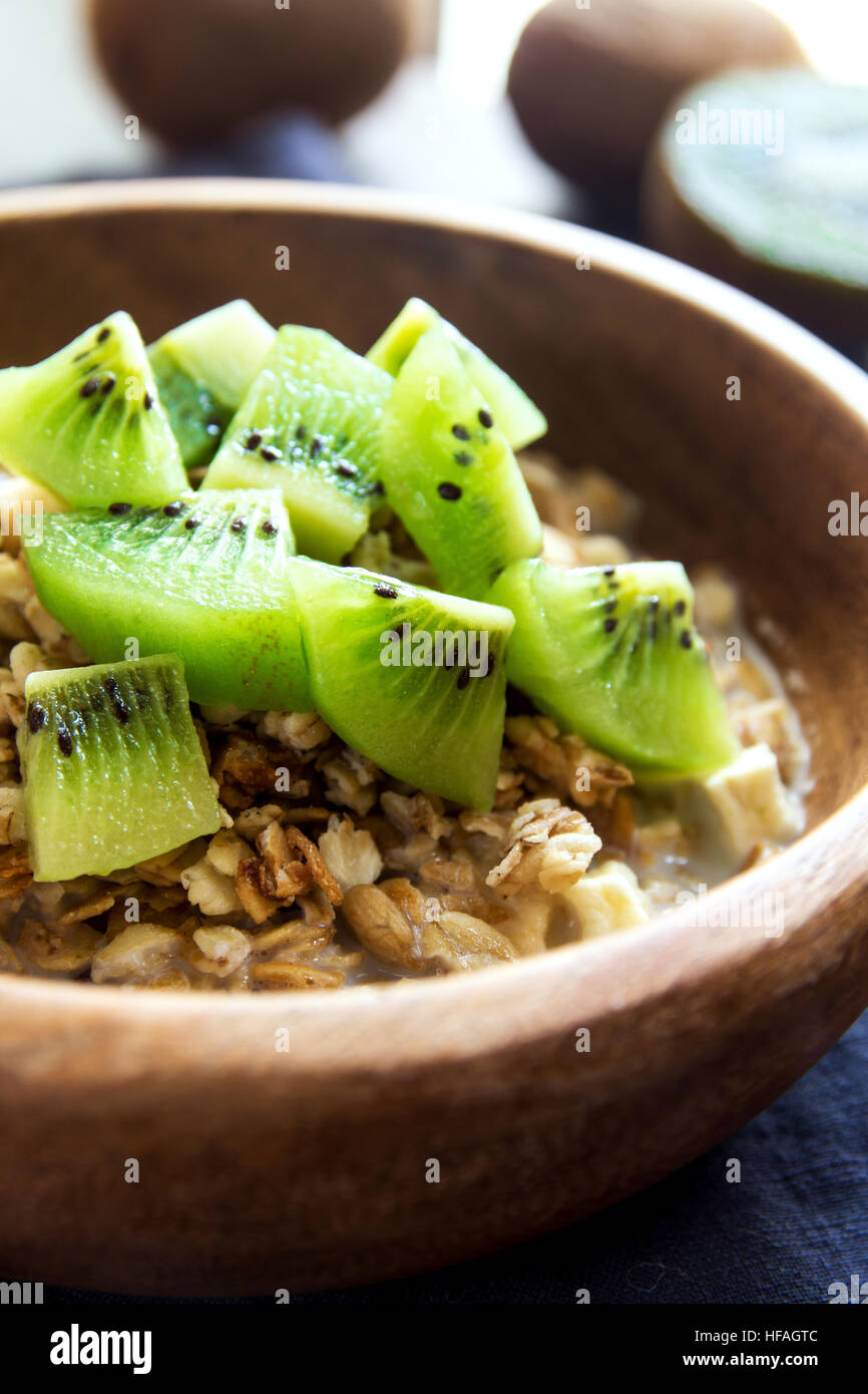 Homemade granola with milk and kiwi fruit for healthy breakfast Stock Photo