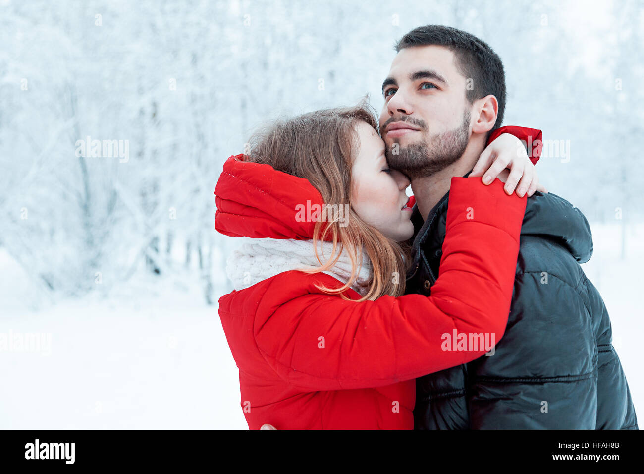 Young couple resting in park, embrace and smilling of loving Stock Photo