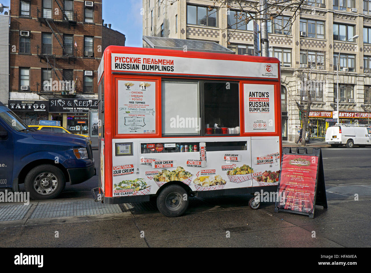 An unusual bilingual food cart of Sixth Ave. in Greenwich Village, NYC,  selling Russian Dumplings with sour cream. Stock Photo