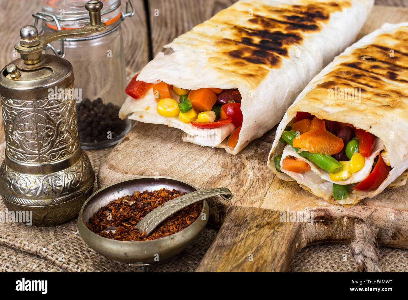 Shawarma with vegetables on a wooden background Stock Photo Alamy