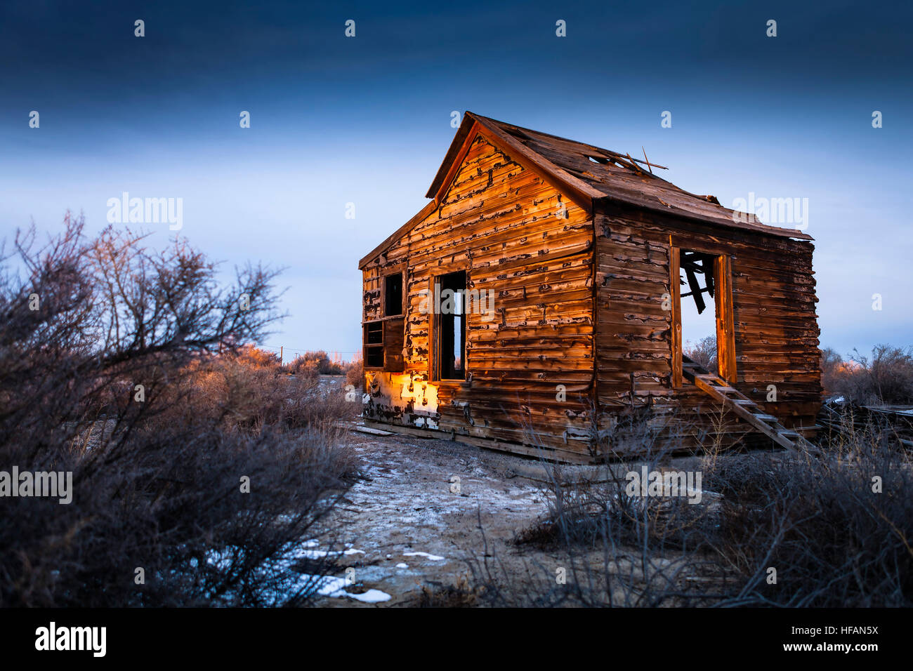 Old abandoned house near Fallon, Nevada at Sunset Stock Photo