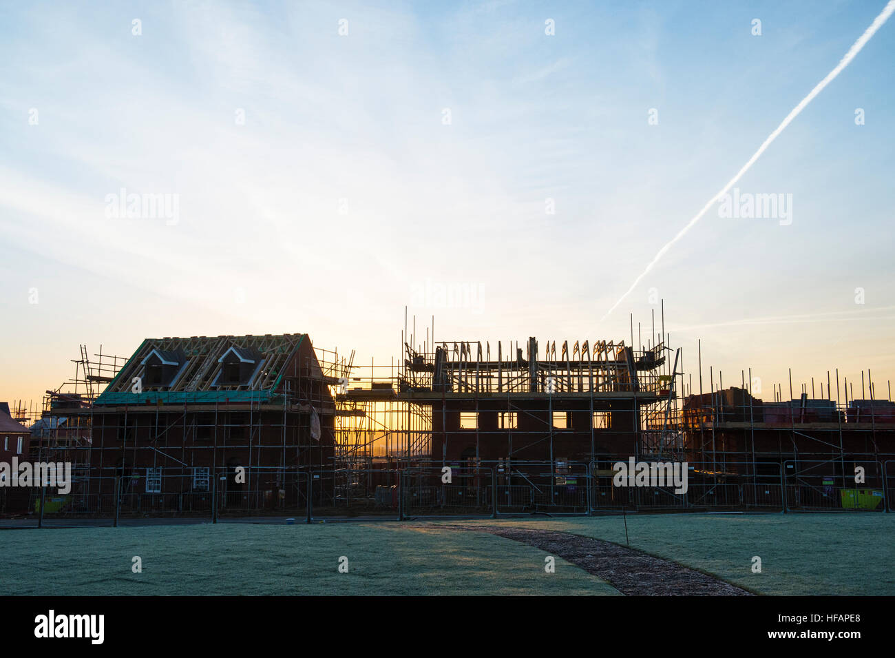 New housing development at sunrise. Silhouette. Banbury, Oxfordshire, England Stock Photo