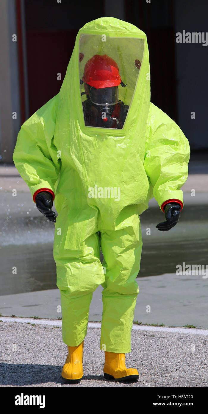 person with great yellow suit against biological risk during an anti-terrorism exercise Stock Photo