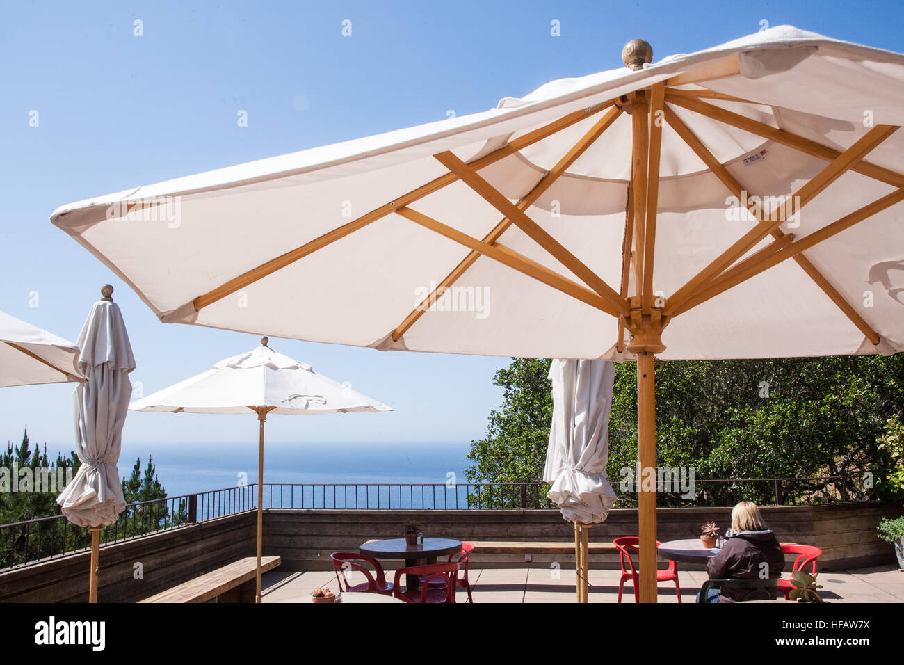 At Nepenthe Cafe Kevah,restaurant outdoor seating with views of the Pacific Ocean at Big Sur,California,USA. Stock Photo