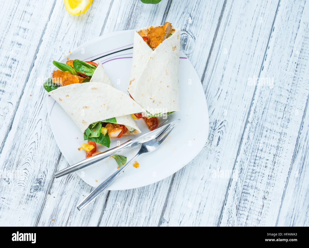 Chicken Wrap (detailed close-up shot; selective focus) on wooden background Stock Photo