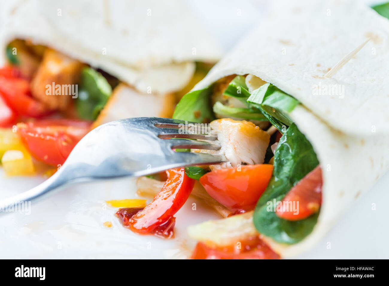 Chicken Wrap (detailed close-up shot; selective focus) on wooden background Stock Photo