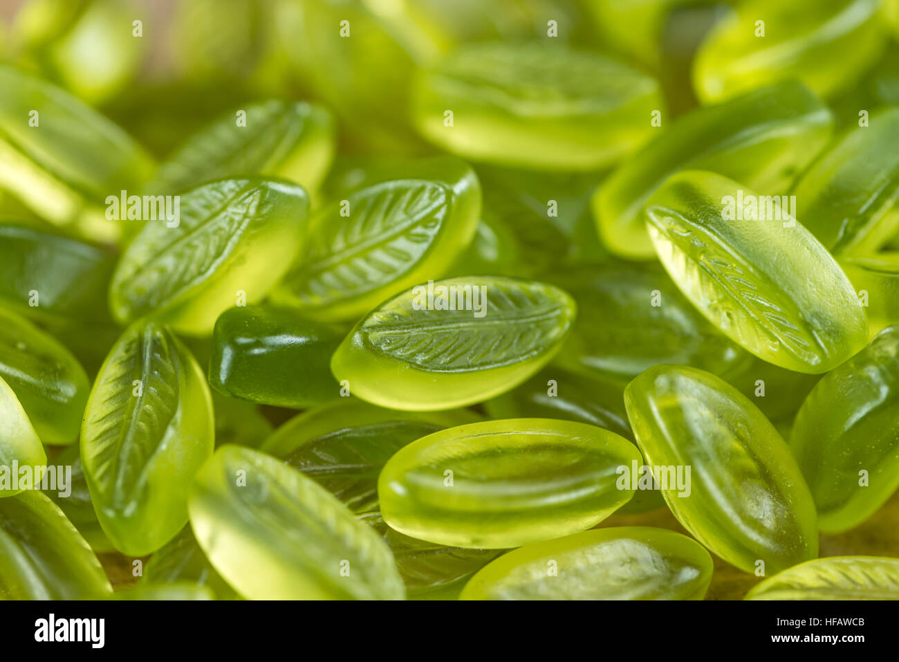 Lime candy (selective focus) on wooden background (close-up shot Stock ...