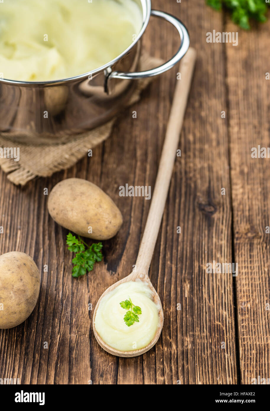 Potato Mash on rustic wooden background (close-up shot) Stock Photo