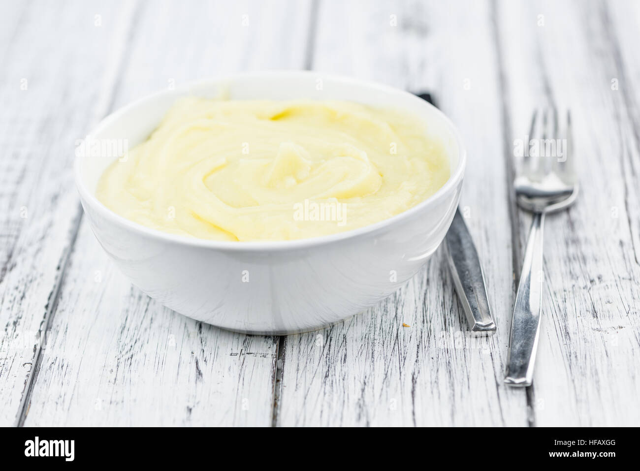 Potato Mash on rustic wooden background (close-up shot) Stock Photo