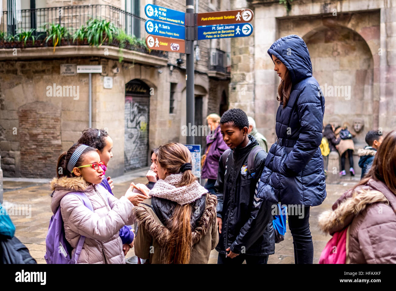 School children play in the streets of the Gothic district of Barcelona Spain Stock Photo