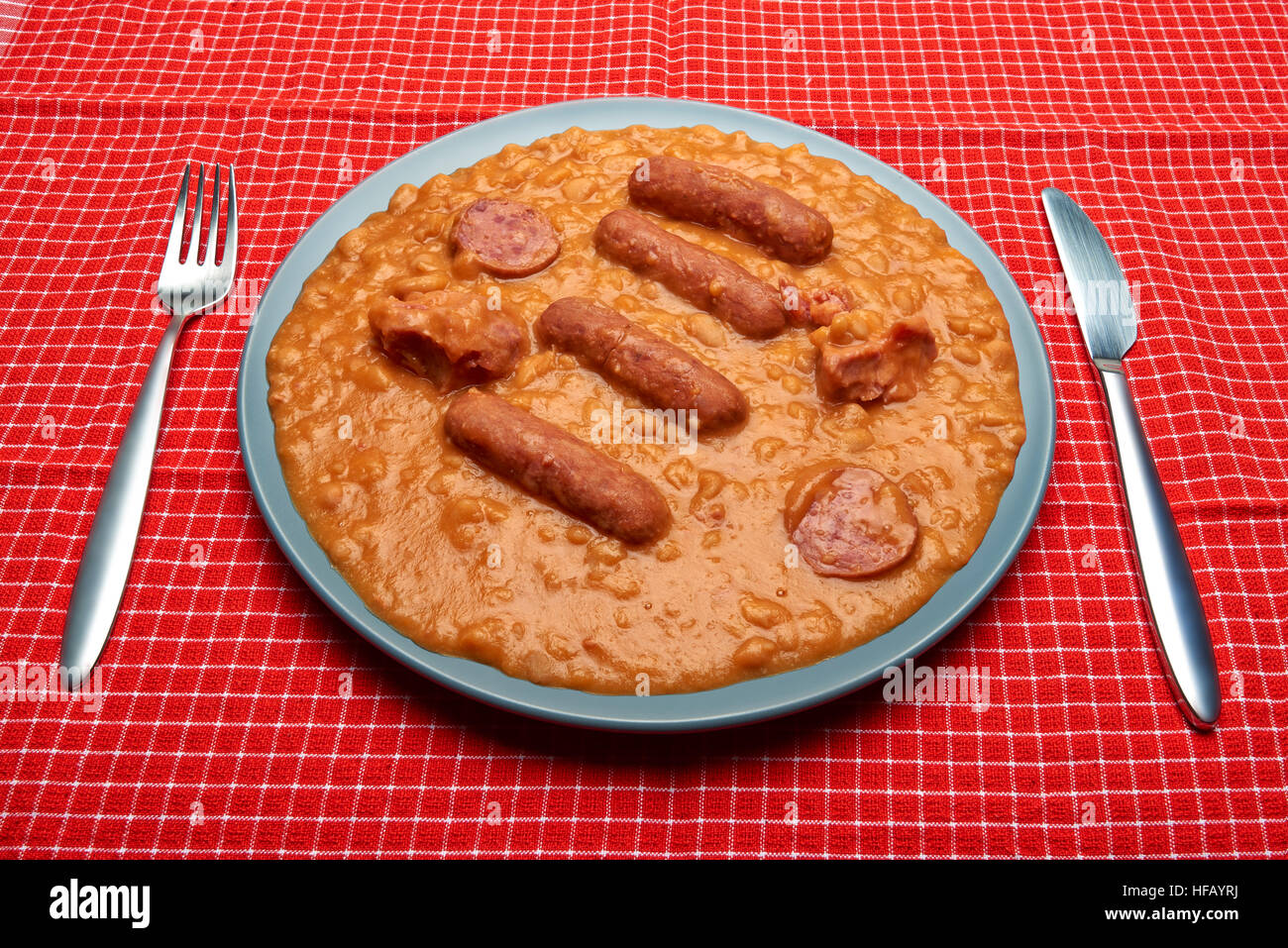 Cassoulet on blue plate and red napkin Stock Photo