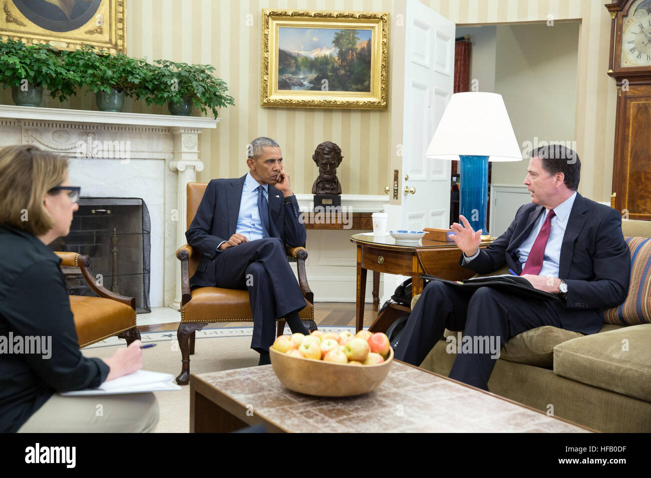 President Barack Obama receives an update in the Oval Office from FBI ...