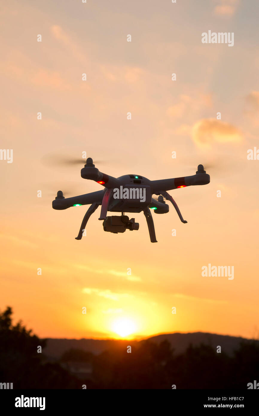 Drone hovering at sunset Stock Photo Alamy