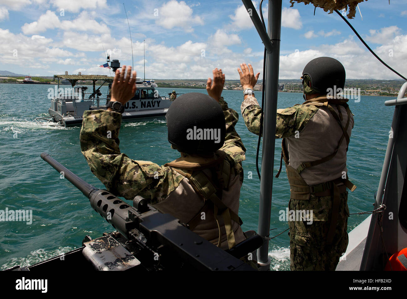 Boatswain's Mate 2nd Class Angelique Barboa (left) and MasteratArms 2nd Class Juancarlos