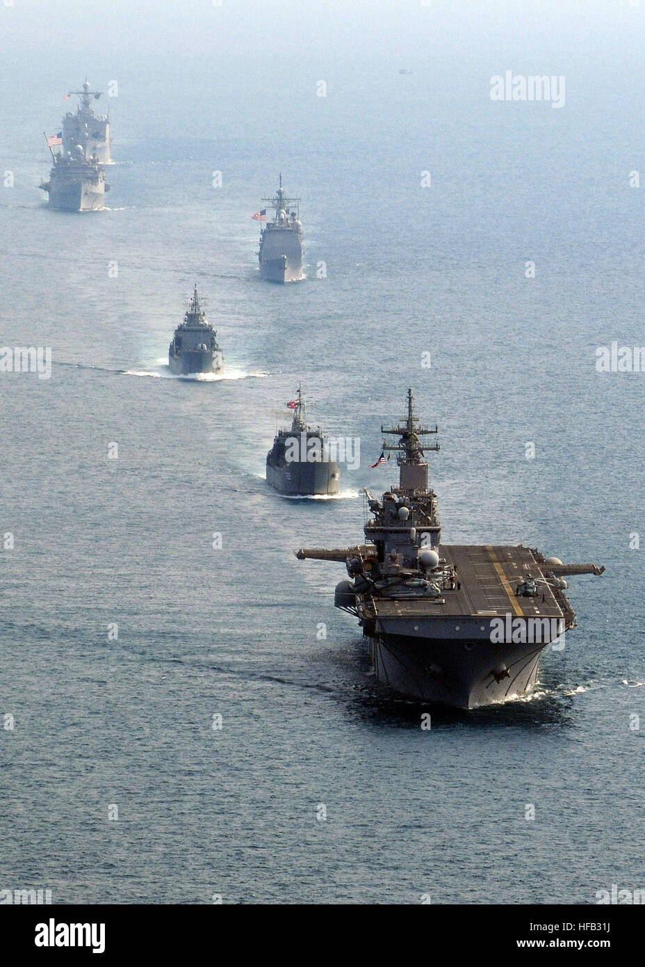 The forward-deployed amphibious assault ship USS Essex (LHD 2), the Royal Thai navy medium landing ship HTMS Surin (LST 722), the Republic of Korea navy tank landing ship Seongin Bong (LST 685), the Ticonderoga-class guided-missile cruiser USS Shiloh (CG 67), the forward-deployed amphibious dock landing ship USS Harpers Ferry (LSD 49) and the forward-deployed amphibious transport dock ship USS Denver (LPD 9), transit in formation in the Gulf of Thailand during exercise Cobra Gold 2010. Cobra Gold 2010 252995 Stock Photo
