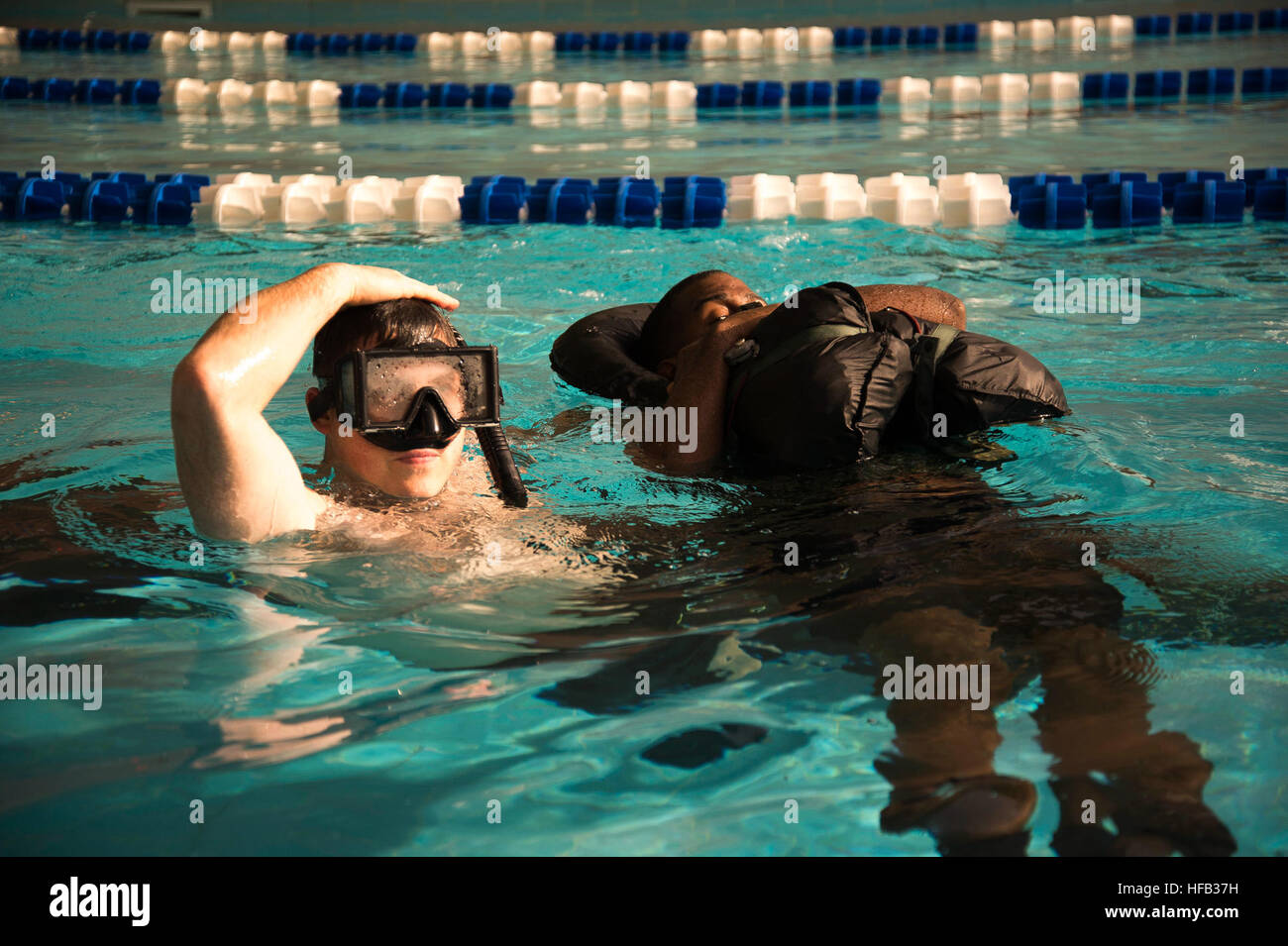 Naval Aircrewman conducts a Search and Rescue signaling exercise with ...