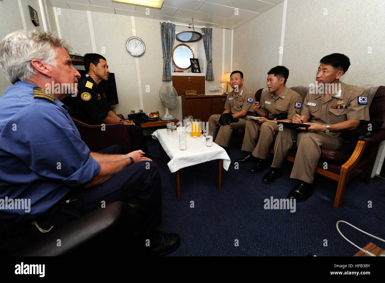 Royal Fleet Auxiliary British Capt. Ian Pilling, left, and Royal Thai Navy Rear Adm. Tanin Likitawong meet with Republic of Korea Navy, Capt. Kim Eun Soo aboard the Royal Fleet Auxiliary Fort Victoria (A387). Fort Victoria is assigned to Combined Task Force 151, a multinational mission-based task force, working under the Combined Maritime Forces, to conduct counterpiracy operation in the Red Sea, Gulf of Oman, Somali Basin and Arabian Sea. Combined Task Force 151 120416-N-AZ513-050 Stock Photo